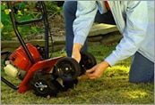 Man maintaining a Honda FG110 Tiller